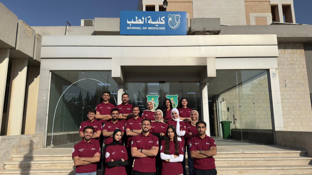 UJLC team standing outside the University of Jordan School of Medicine