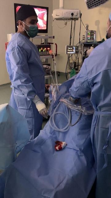 A medical student observing a surgical procedure